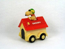 Snoopy Rides On Doghouse