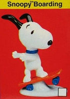 Flambro Snoopy Boarding Porcelain Figurine