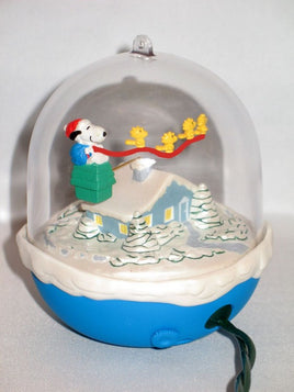 1997 Snoopy Plays Santa Motion Christmas Ornament