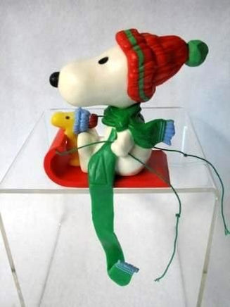 SNOOPY ON SLED STOCKING HOLDER - snoopn4pnuts.com