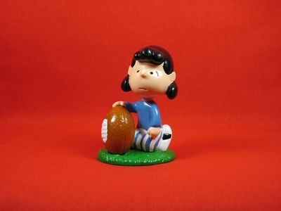 Lucy Holds Football Pvc