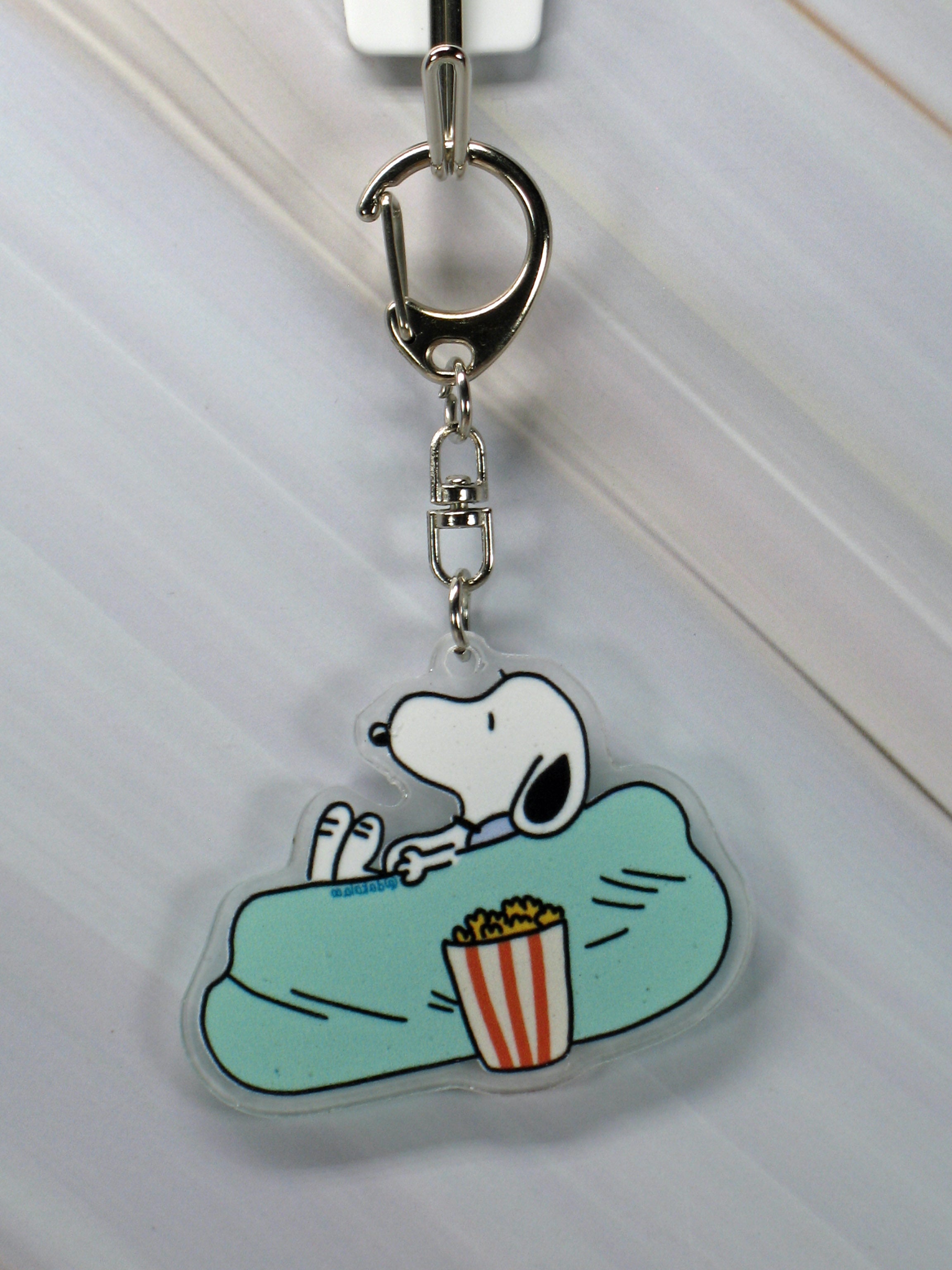 Peanuts Acrylic Swivel Key Chain - Snoopy on Bean Bag Chair