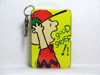 Charlie Brown key chain tin